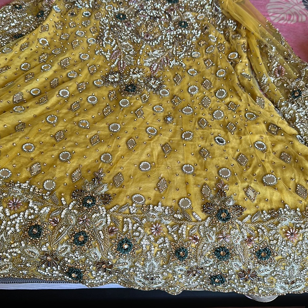Beautiful yellow net and stonework dress yellow and silver work ..